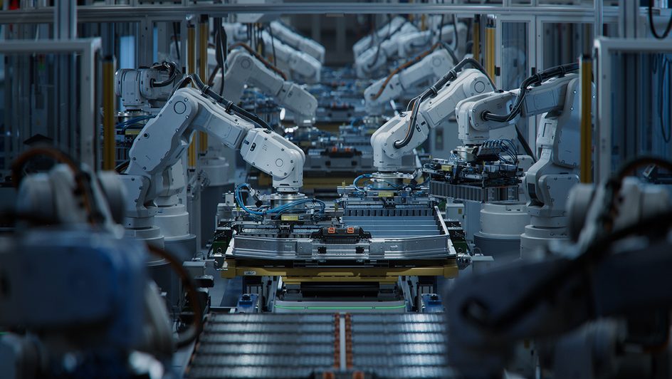Robotic arms at an EV factory