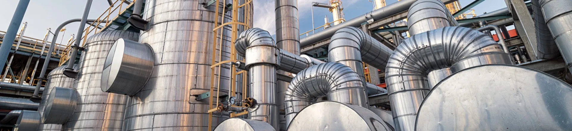 close-up image of a row of oil barrels
