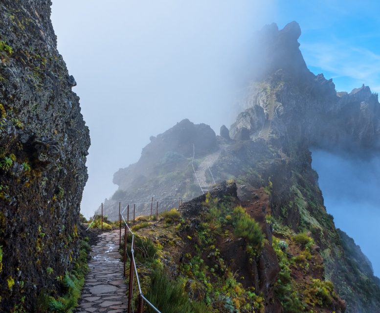 SC Global Research image of walk way in high mountains surrounded by clouds