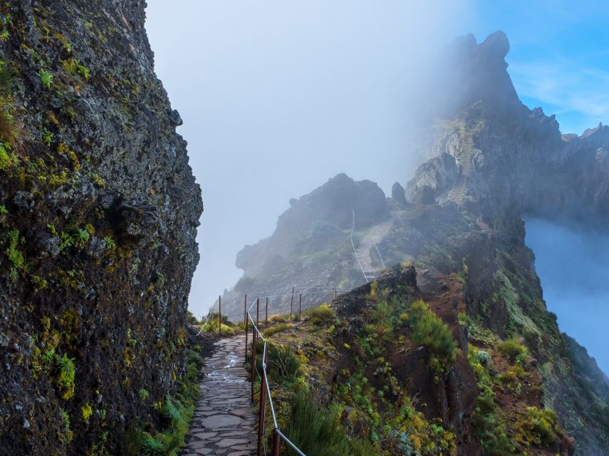 SC Global Research image of walk way in high mountains surrounded by clouds
