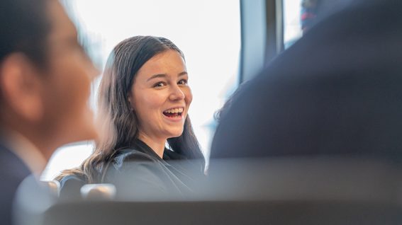 A person smiling at another person