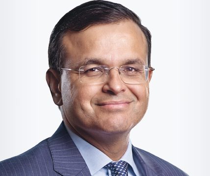 A portrait of Sunil against a white background.