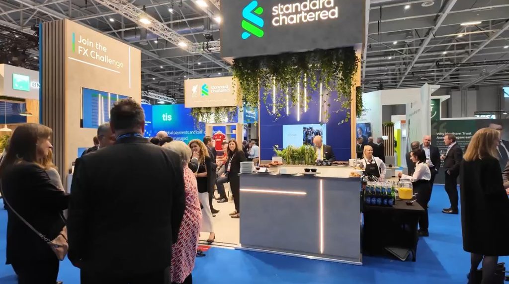 image of people at Standard Chartered's booth at EuroFinance 2025