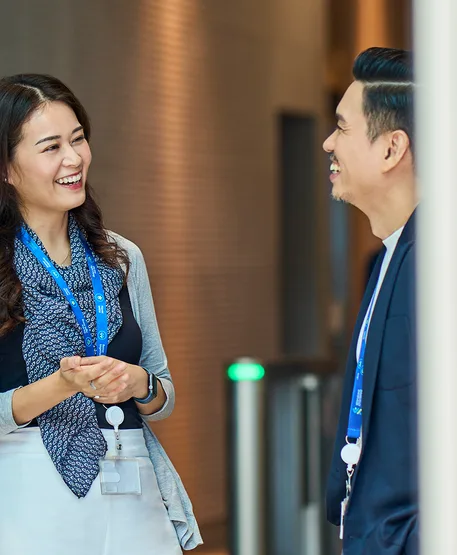 Smiling Standard Chartered employees.