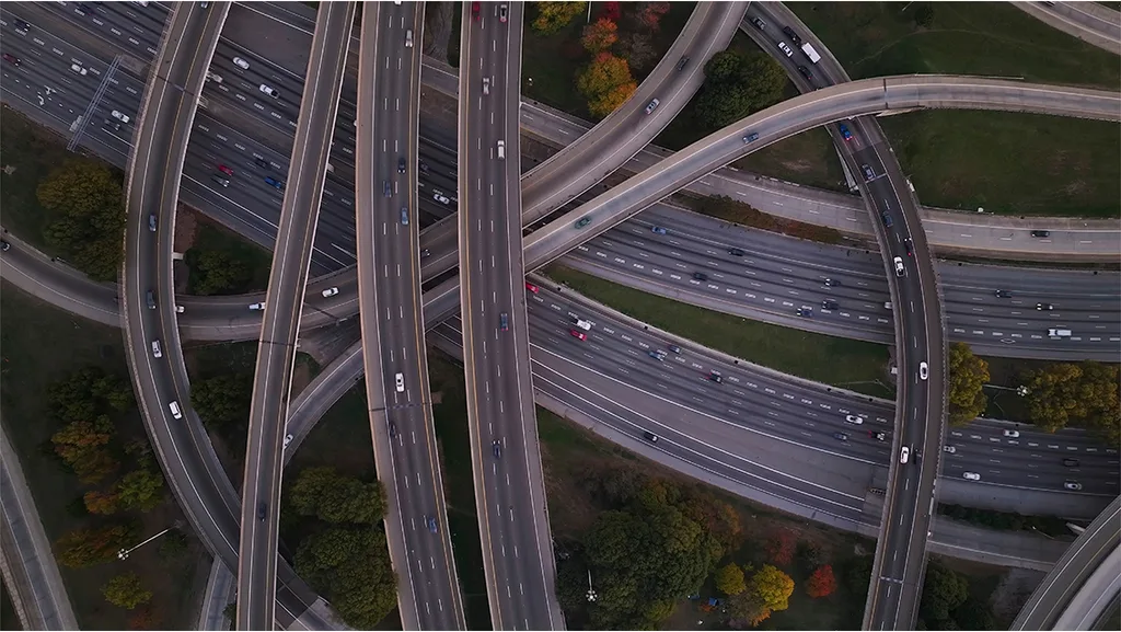 aerial shot of multiple bridges and roads intertwining with each other perfectly