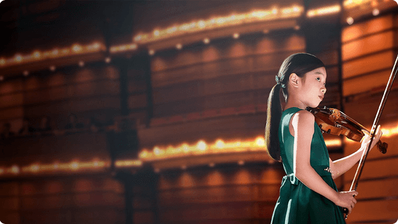 Yeonah Kim prepares to play live on stage in the 'Now is your time' video.
