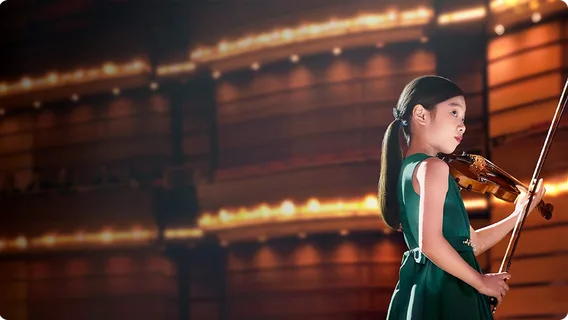 Yeonah Kim prepares to play live on stage in the 'Now is your time' video.