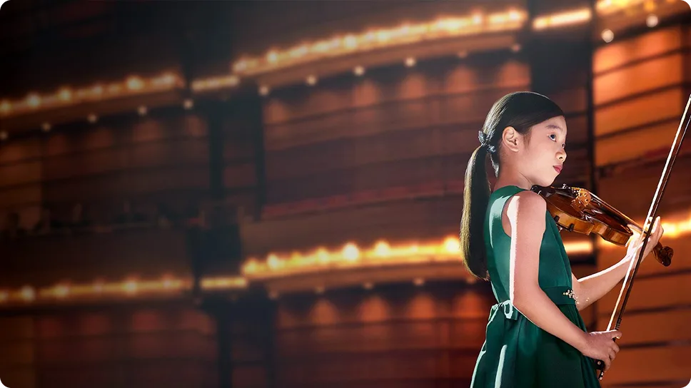 Yeonah Kim prepares to play live on stage in the 'Now is your time' video.