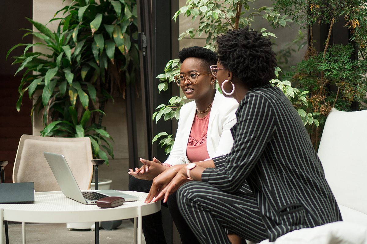 two women discussing work
