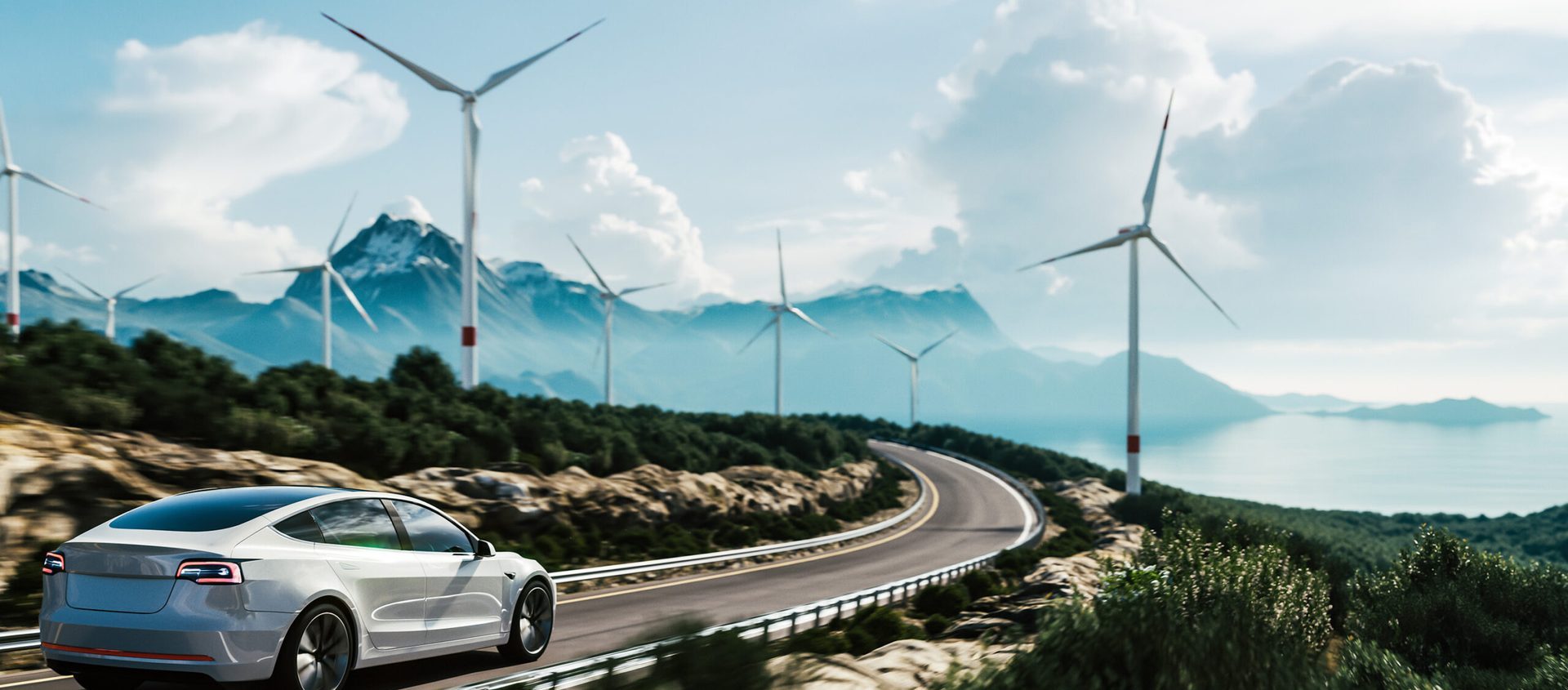 Electric car on road lined with wind turbines