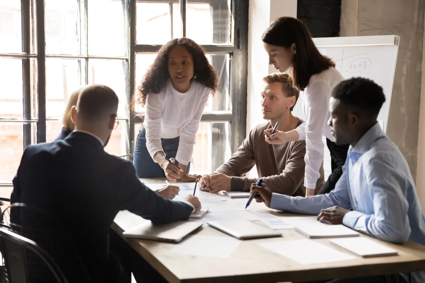 A group of employees discussing work