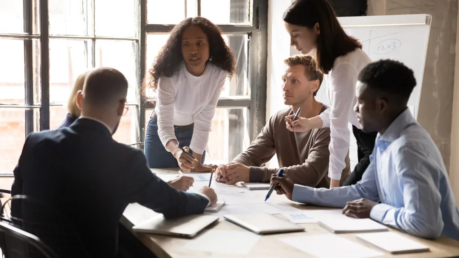 A group of employees discussing work