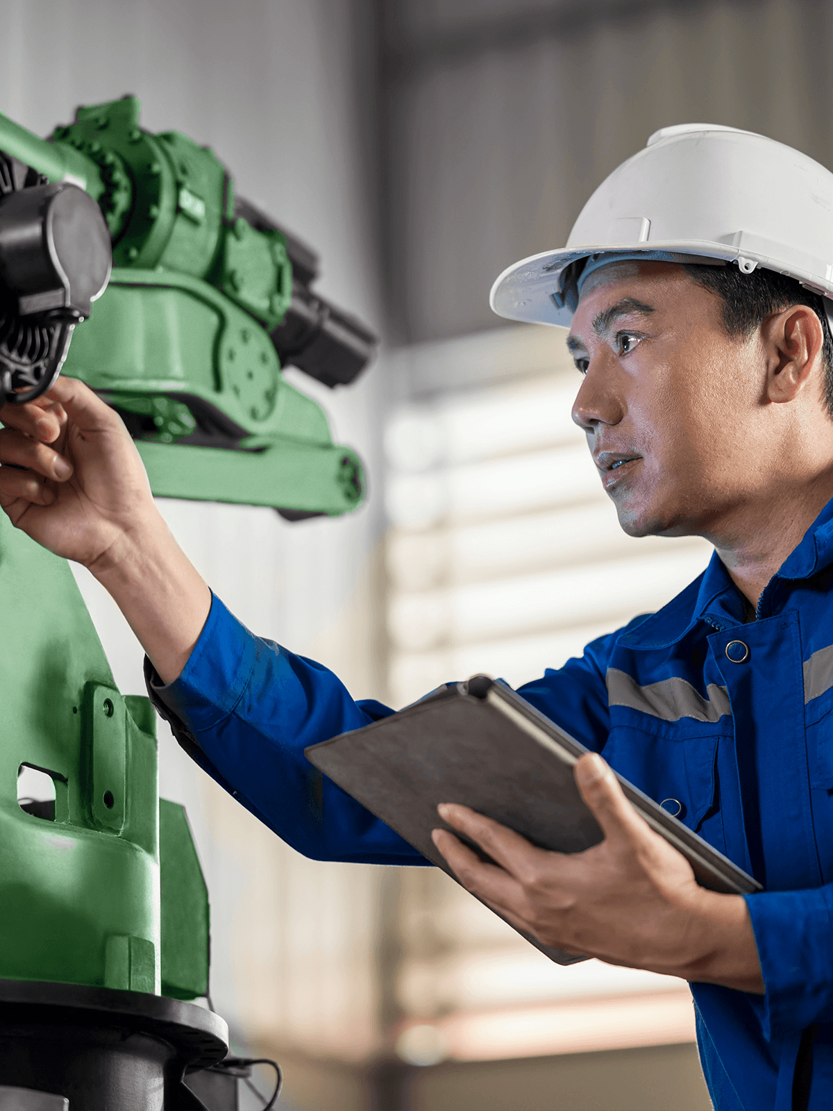 An engineer works on a machine.