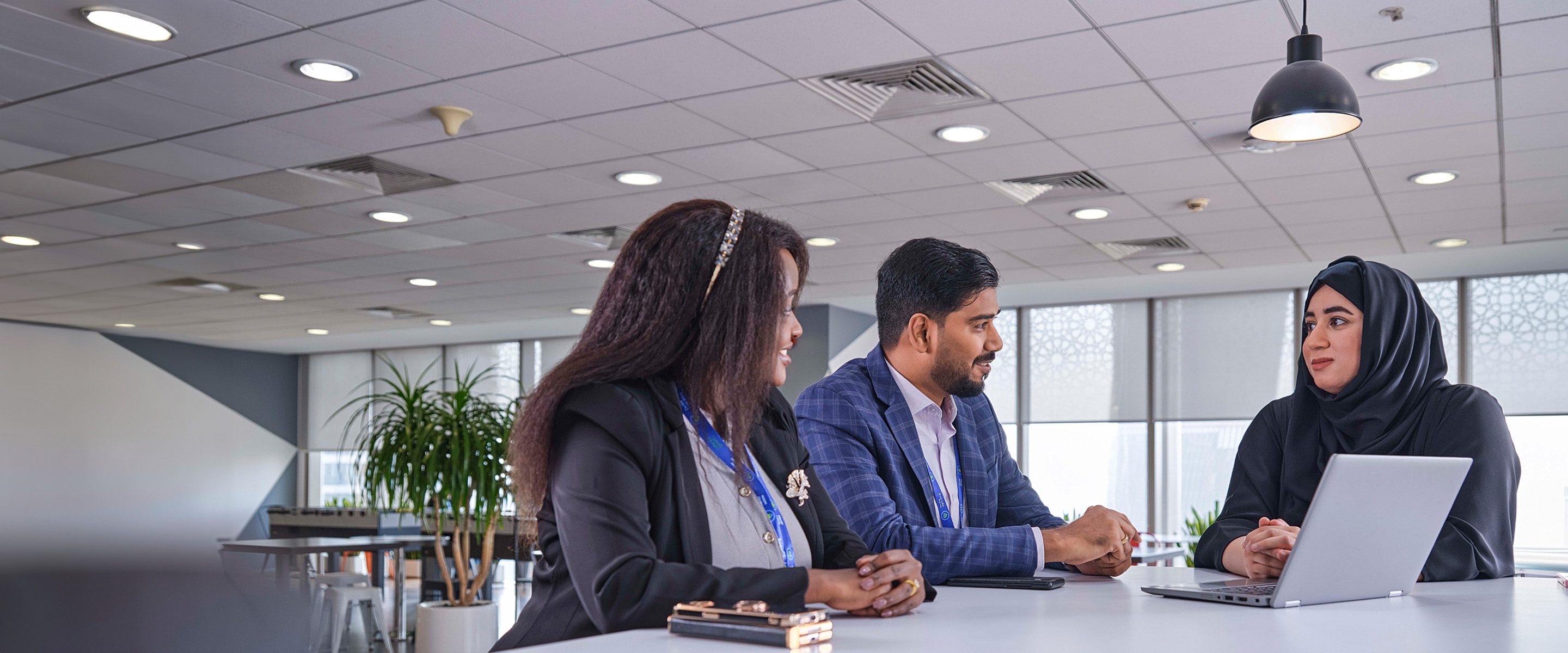 Three colleagues discuss our business model.