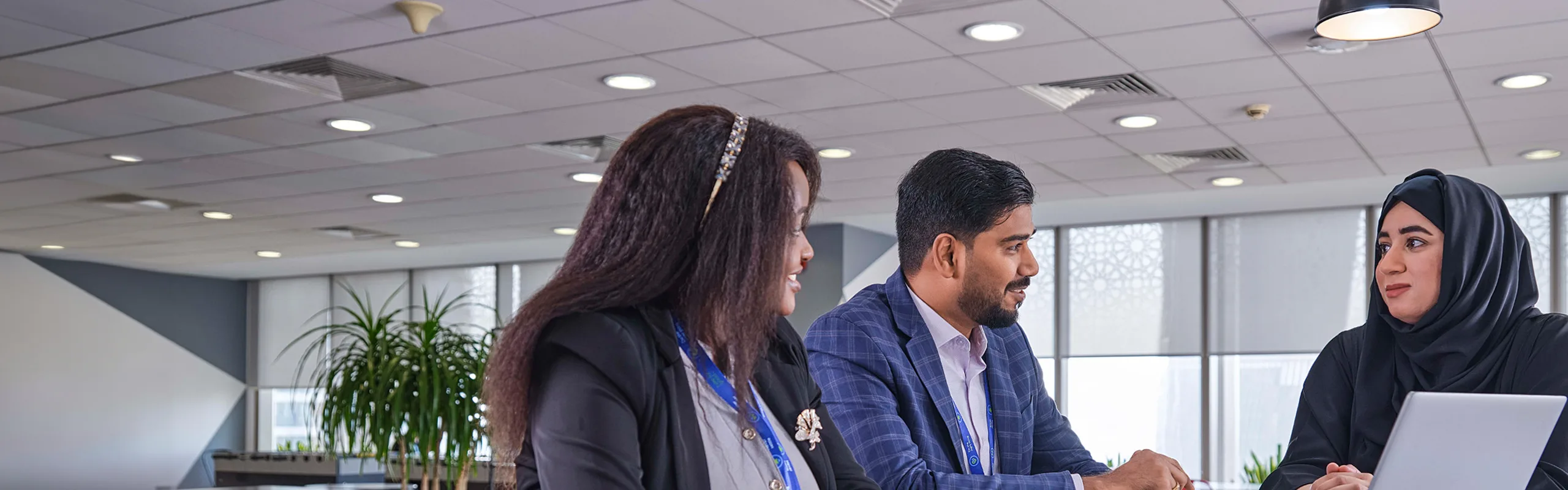 Three colleagues discuss our business model.