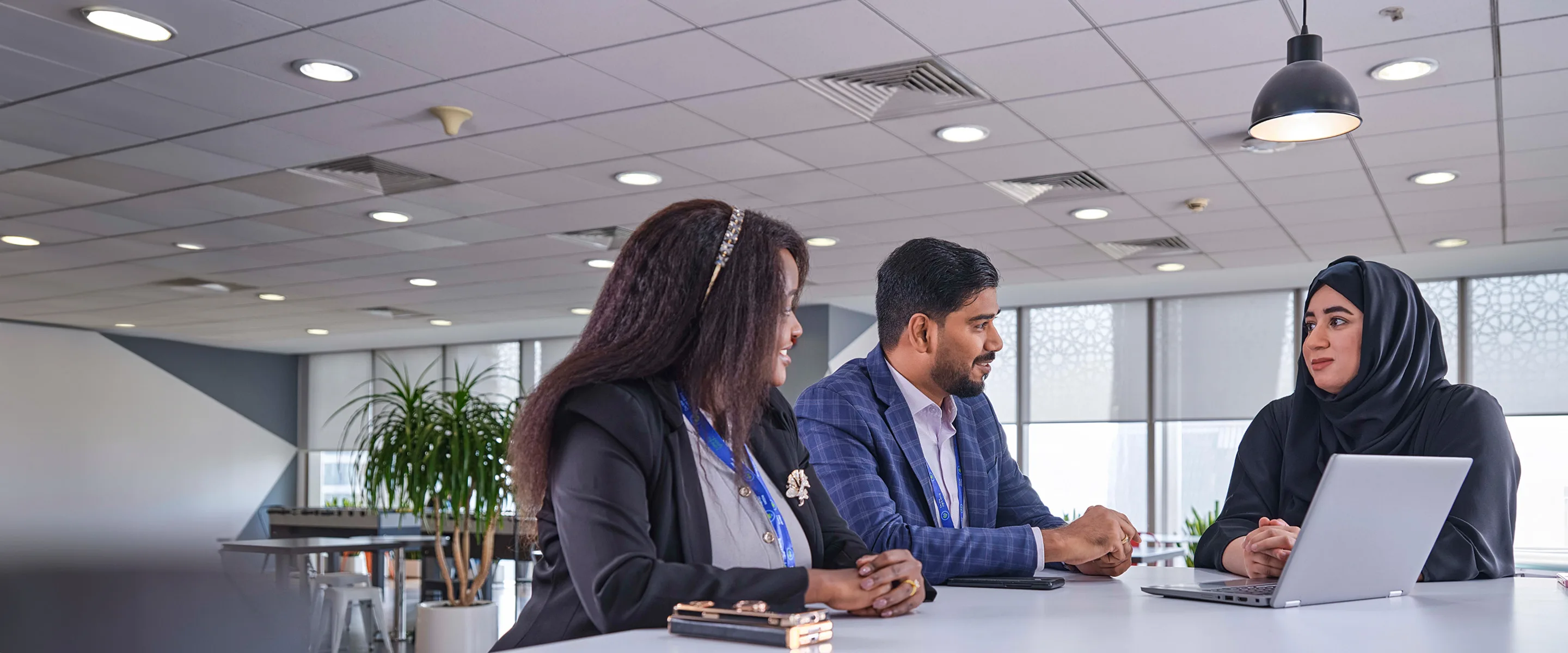 Three colleagues discuss our business model.