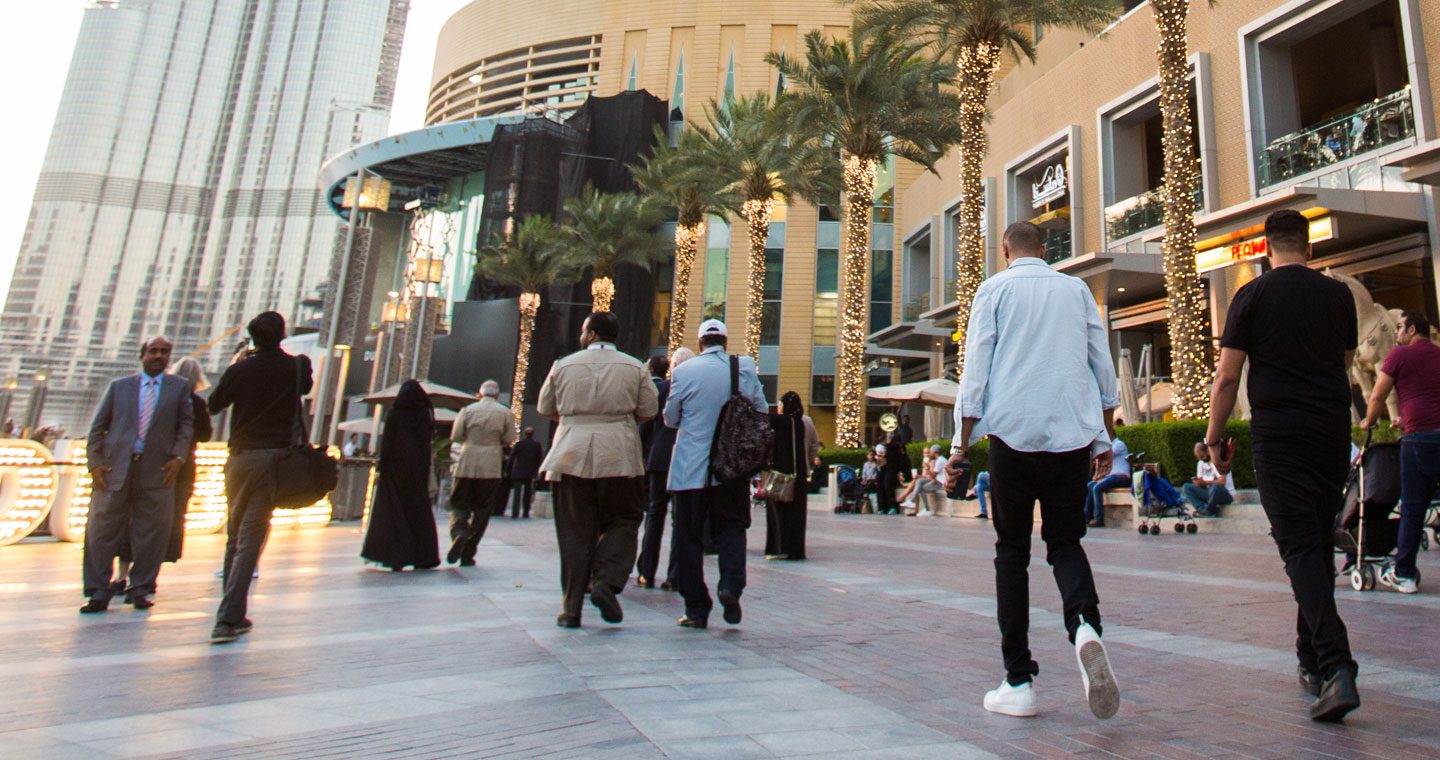 people walking along pedestrianised street