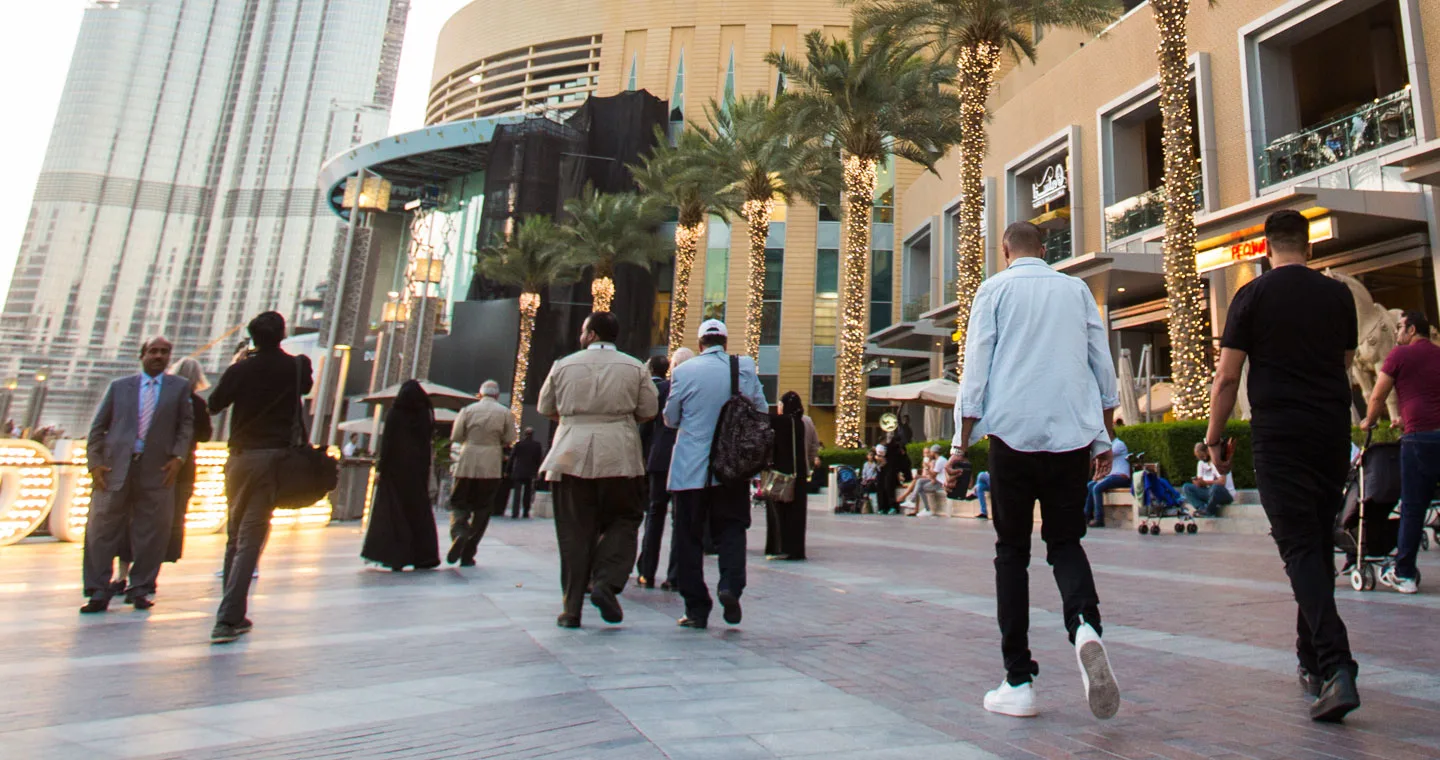 people walking along pedestrianised street
