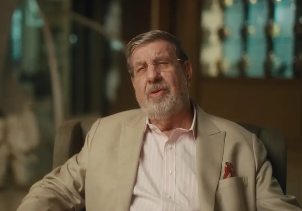 A man speaking to a camera