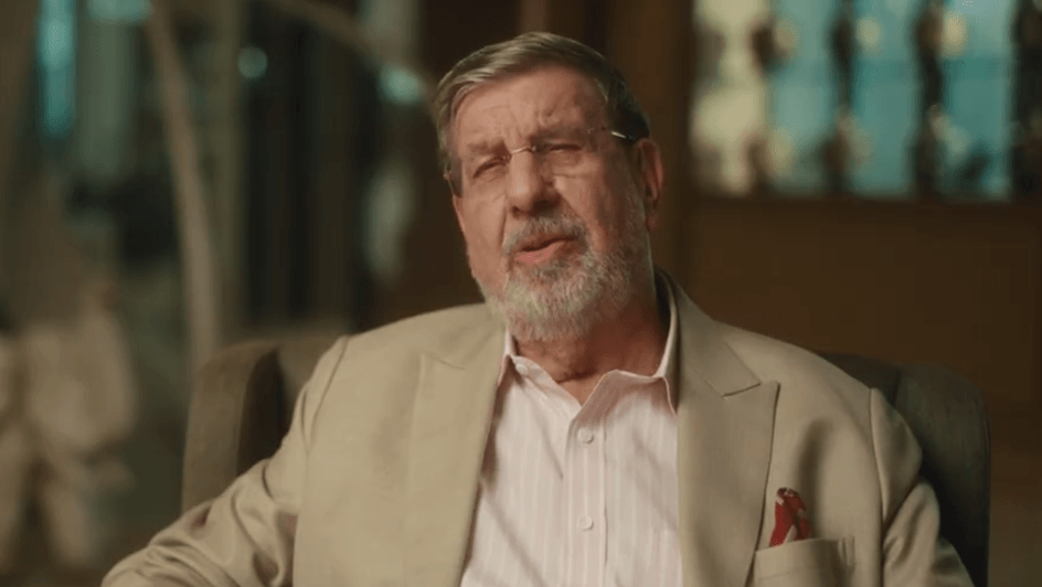 A man speaking to a camera