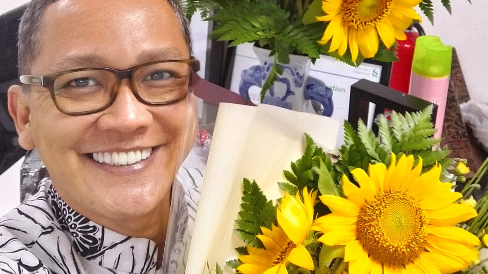 A man with sunflower bouquet