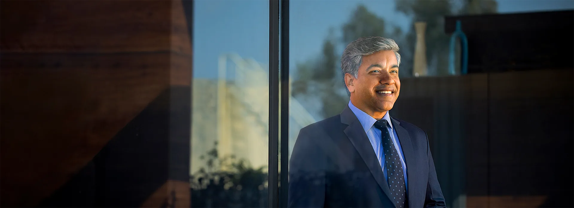 Businessman smiling with his hands clasped