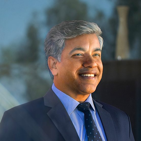 Businessman smiling with his hands clasped