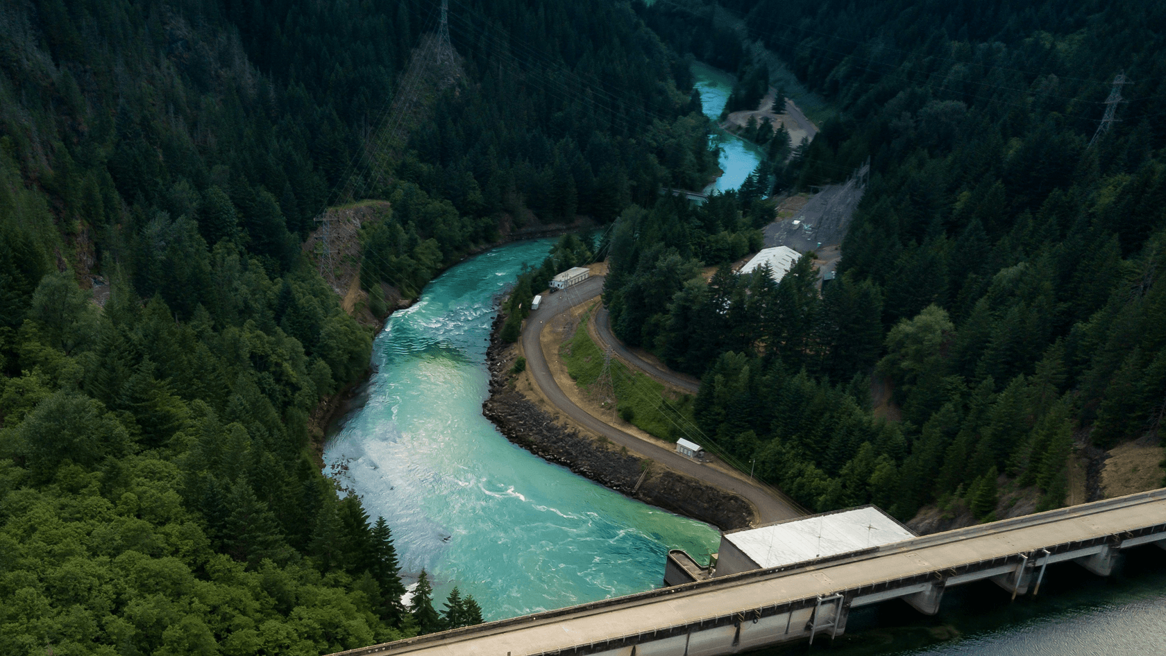A river flows under a bridge.