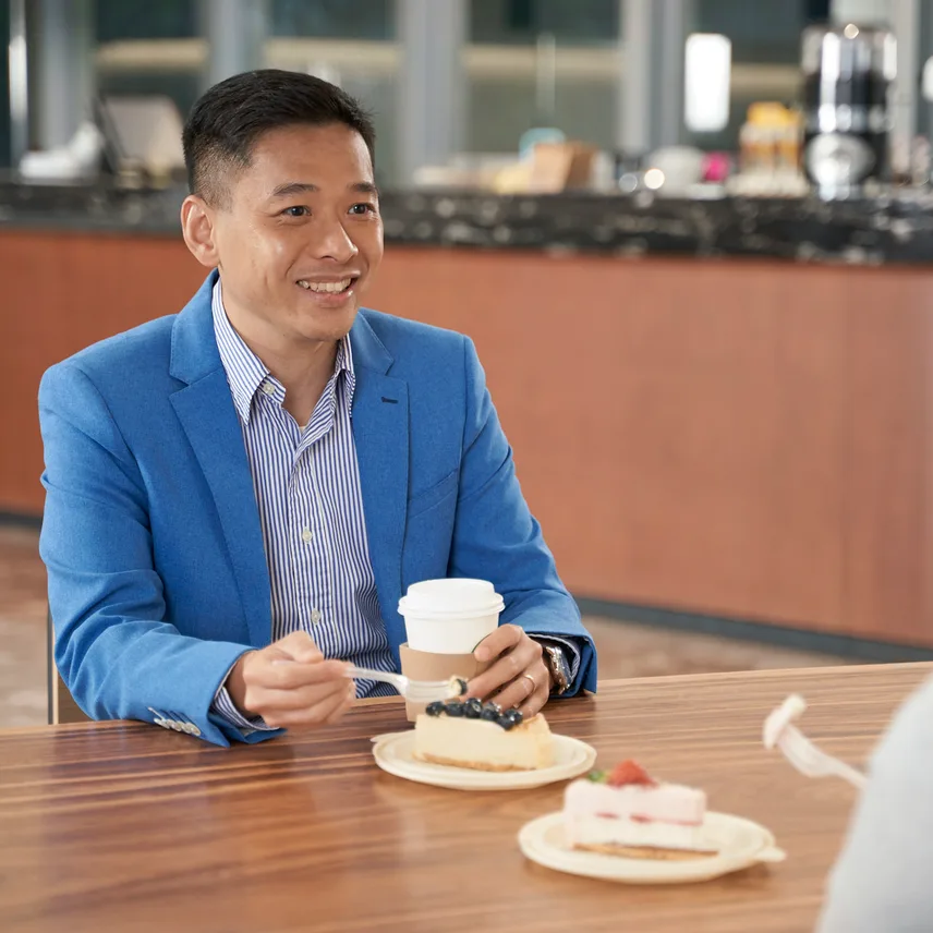 A man with coffee and cake