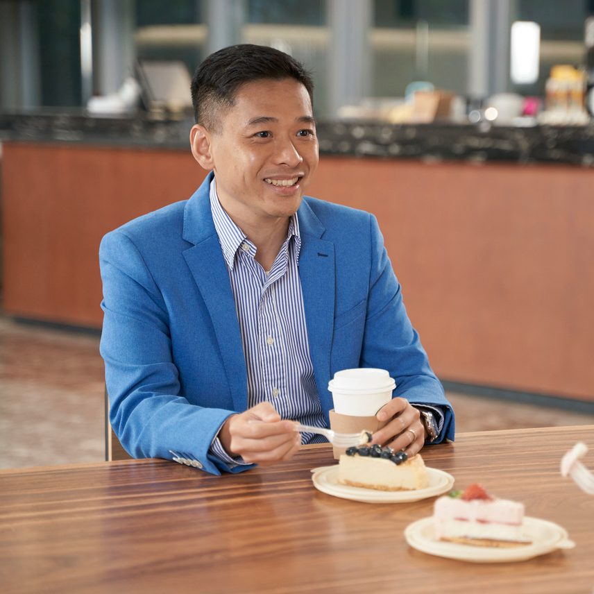 A man with coffee and cake