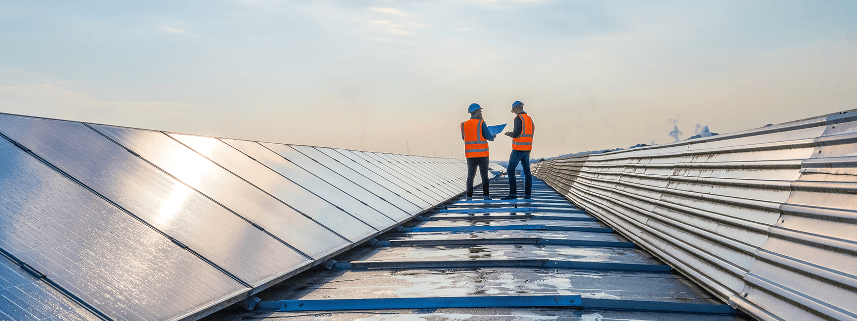 Two workers in a solar field