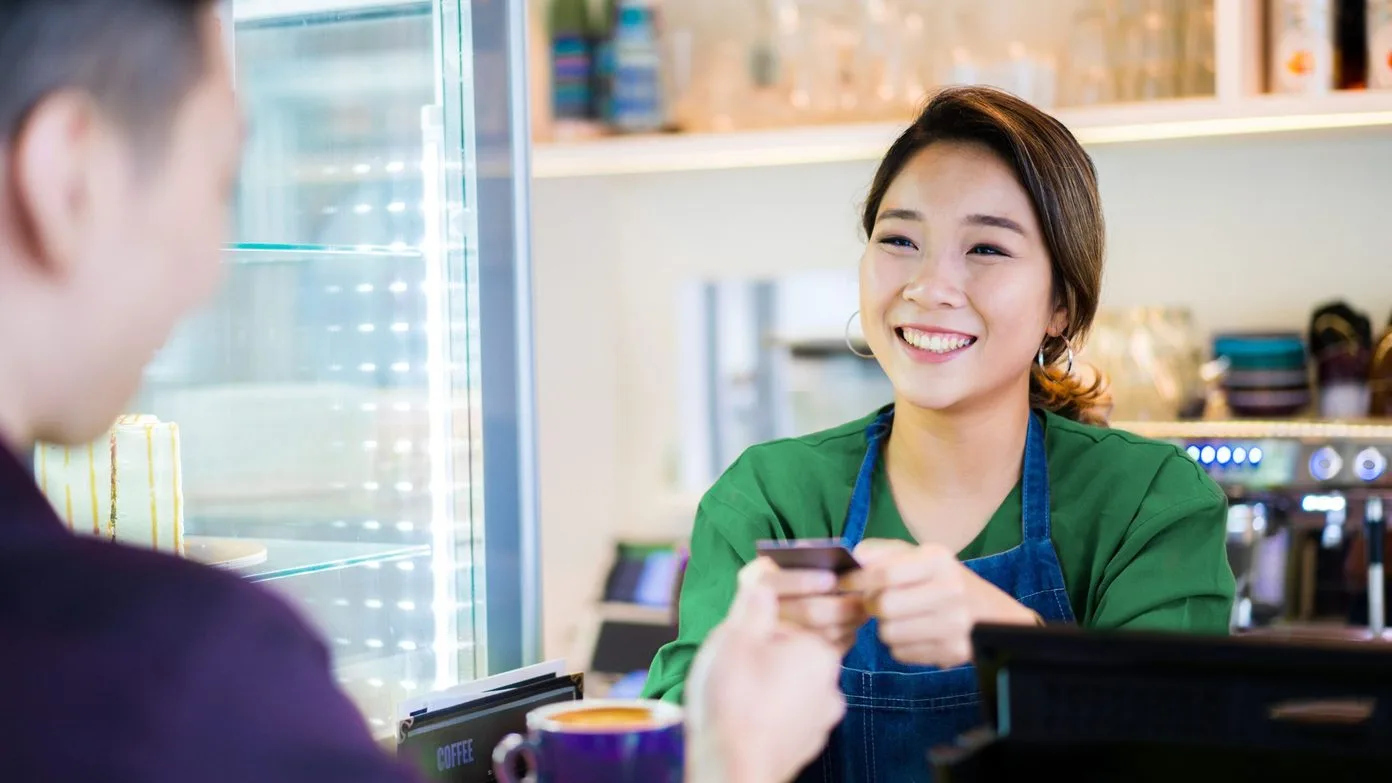 Asian girl over cashier