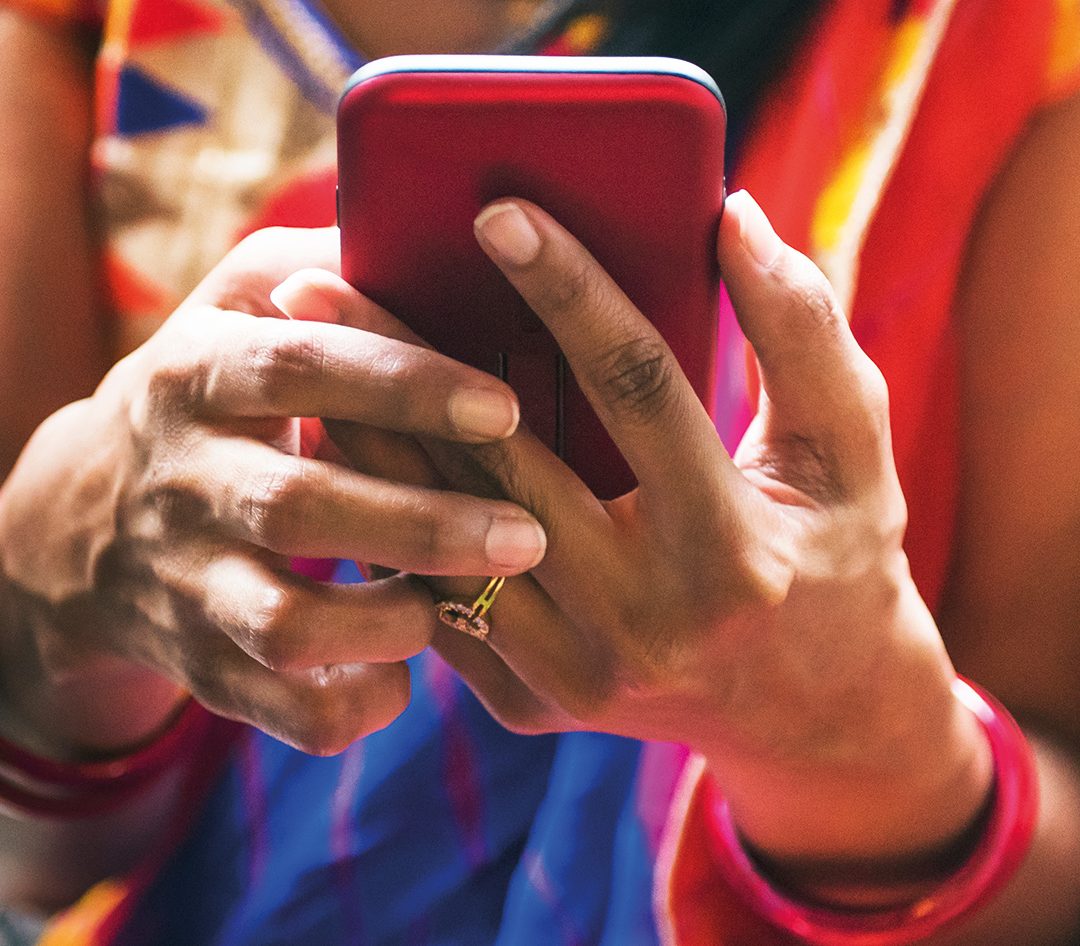 Lady holding smartphone close up