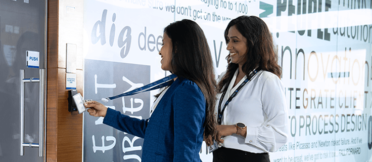 two people entering a meeting room