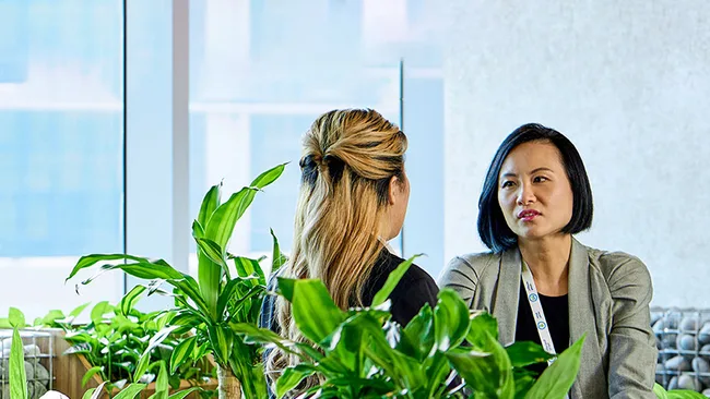 Women discussing at work
