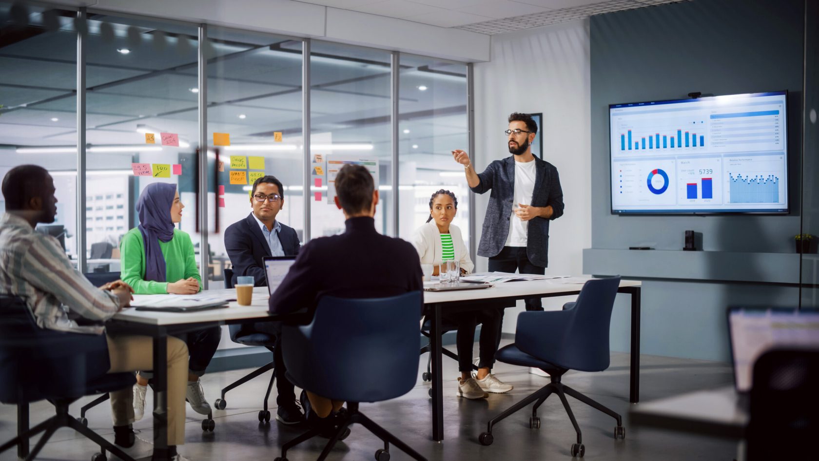 A group of people talking at the meeting