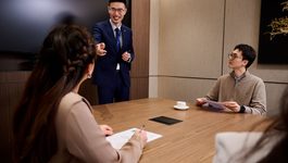 Three colleagues working together in office