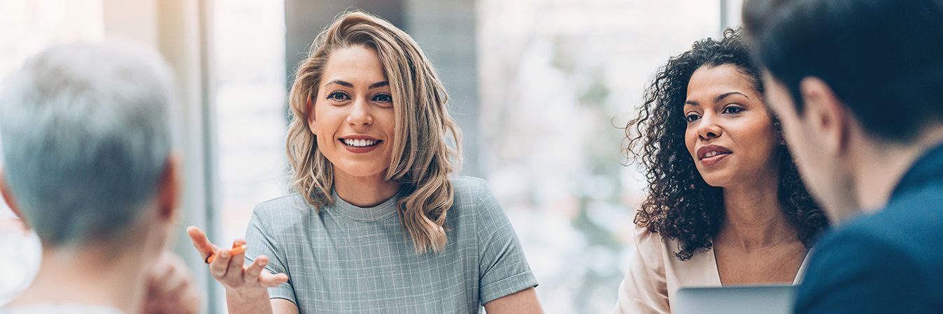 4 people having meeting indoors