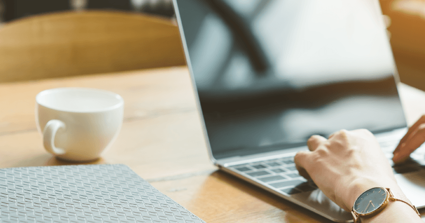 Laptop on wooden table