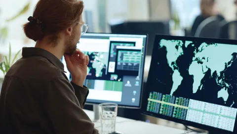 A man looking at a computer screen