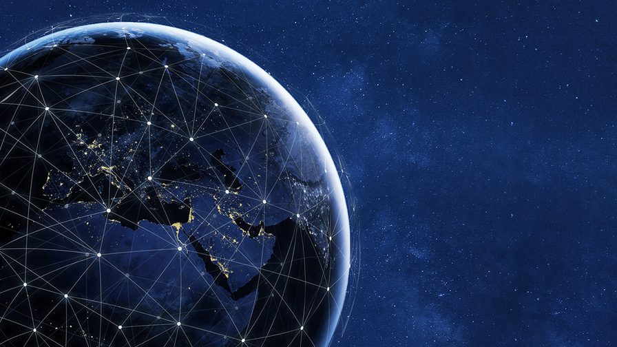 An image representing global connectivity around the globe with glowing lines
