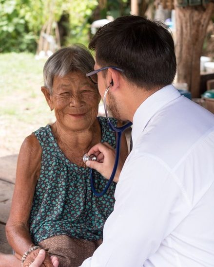 Doctor checking over patient