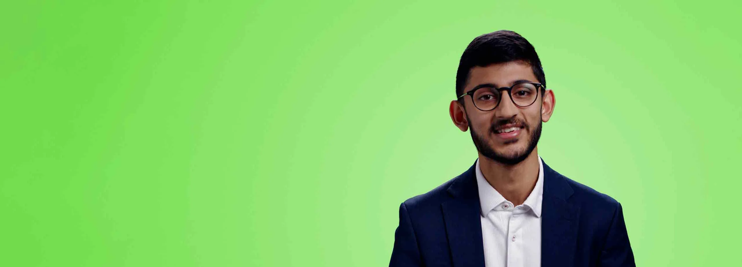 Man with glasses looking at the camera