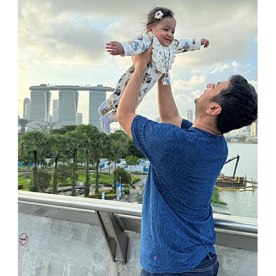 Father carrying baby