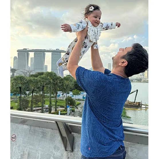 Father carrying baby