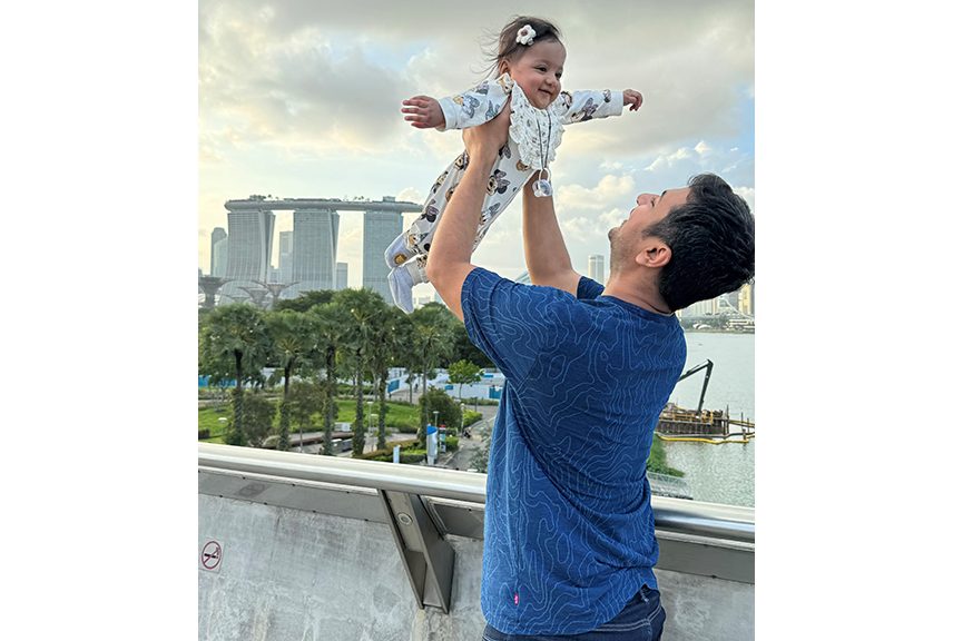 Father carrying baby