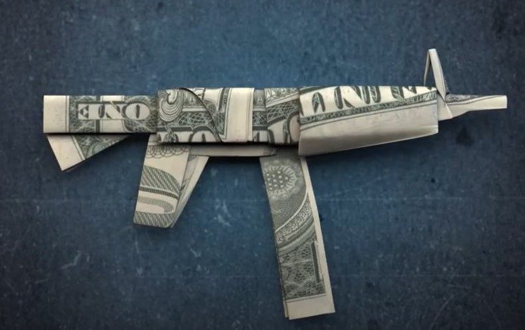 An illustration of a gun made out of folded dollar bills.