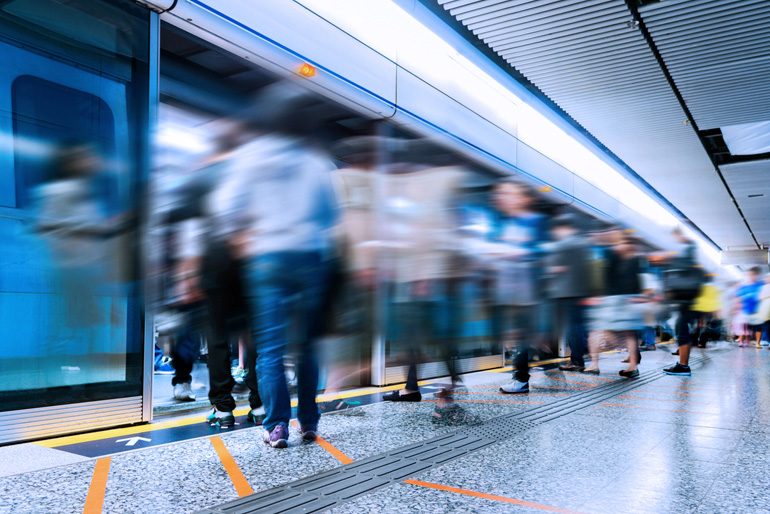 Busy subway station with large group of people