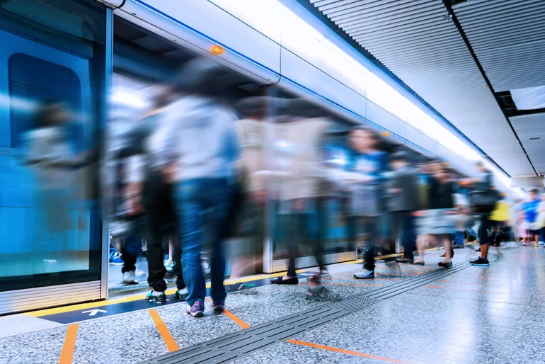 Busy subway station with large group of people