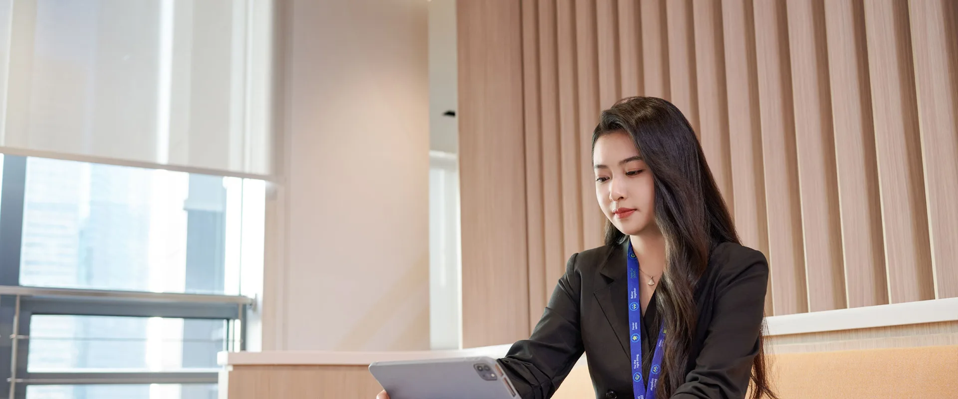 Women working in the office looking at an ipad